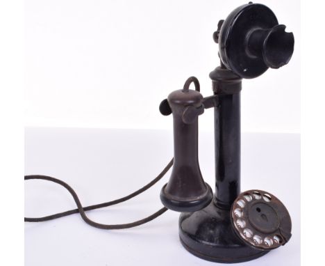 A GEC black candlestick telephone,1920s, with ebonite receiver, C-type microphone and brass dial; with a type 1A bellbox. (2)