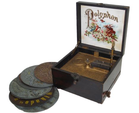 A 6.1/2-inch Polyphon disc musical box,Circa 1905, Ser. No. 3821,With side lever-wind motor, single comb on cast gilt titled 