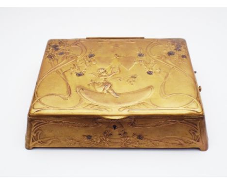 A fine high-Art Noveau gilt metal cushion-form musical wedding casket,Circa 1905, With enclosed large cartel 3-air cylinder m