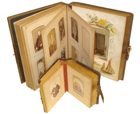 Victorian musical family photograph albums:Both circa 1890, The larger with French movement Ser. No. 221404 playing two airs,