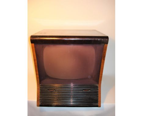 A PYE type VT4 table television receiver,1953, 405-line, 15-inch screen, with light pink filter cover, concave front sloped p