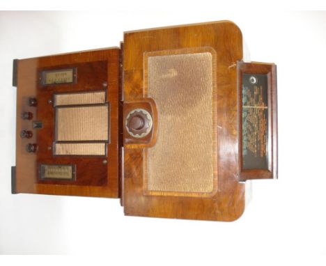 A Mullard type MAS8 wireless receiver,With central universal control, pop-up dial with magic eye; and a Marconi type 442 with