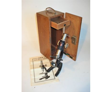 A small monocular microscope, by S.E.L.,1950’s, with single objective and ocular, company leaflet, in mahogany fitted case. 