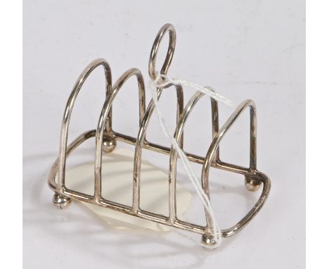 Edward VII silver four slice toast rack, London 1904, maker Goldsmiths and Silversmiths Company Ltd. with pierced loop finial