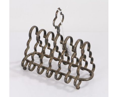 Silver plated six slice toast rack, the pierced shaped finial above arched divisions, raised on four orb feet, 14 cm high,&nb