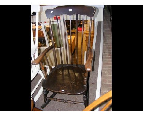 A stick back rocking chair