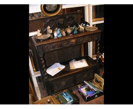 A Victorian oak buffet with hinged lower compartment 