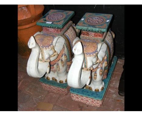 A pair of decorative glazed ceramic Elephant garden ornaments - 54cm high CONDITION REPORTcouple of repairs and chips in plac
