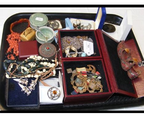 An assortment of costume jewellery, military medals and trinket boxes etc 