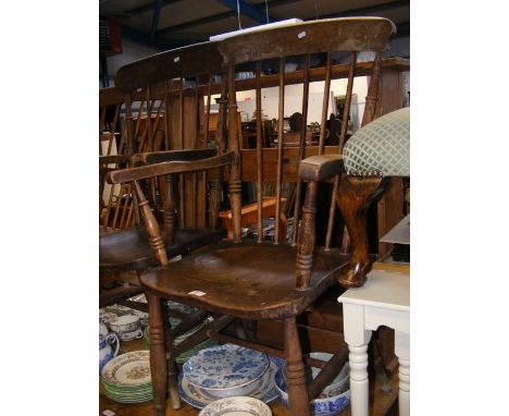 A Windsor stick back armchair with elm seat