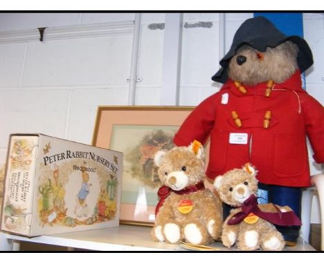 A vintage Paddington Bear with red coat, two Steiff teddies, Peter Rabbit nursery set by Wedgwood etc