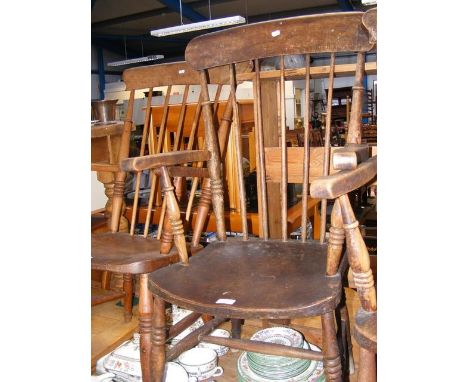 A Windsor stick back arm chair with turned legs