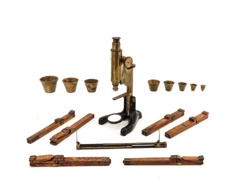 Consisting of 7 miscellaneous pieces, including a copper microscope, marked Beck Ltd. London, model 22, height 29 cm.