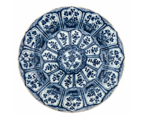Full floral decor, 18th Century, marked with double ring and lozenge, 38 cm. in diameter, chip.