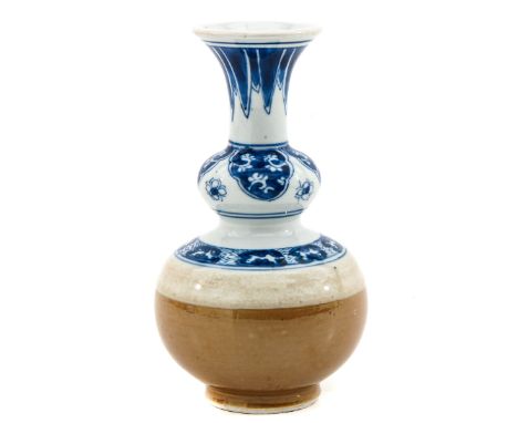 Decorated in blue and cafe au lait floral decor, Kangxi Period, 16 cm. tall. 