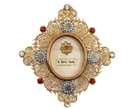 Containing a relic of Saint Bernadette Soubirous, set with stone and enamel plaques, length 10 cm.