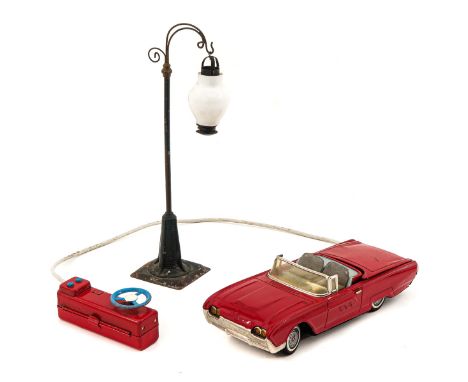 Consisting of Ford Thunderbird with remote control, brand Yonezawa, Japan and street lamp, car length 29 cm.