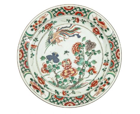 Kangxi Period, depicting flowers in garden with phoenix, 24 cm. in diameter.