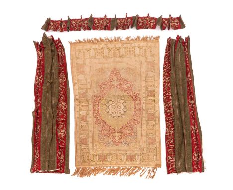 Consisting of a woven carpet, 146 x 188 cm. and a set of curtains
