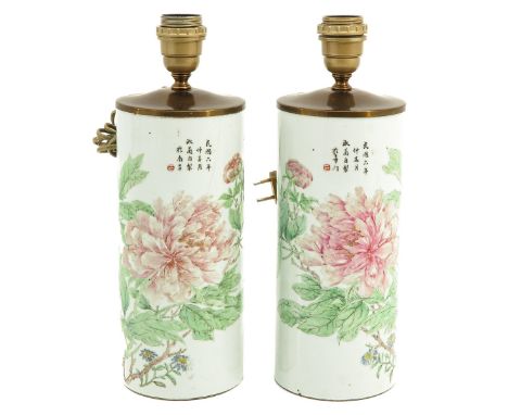 Decorated with flowers and Chinese text, 36 cm. tall, one lamp is restored.