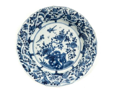 Depicting scene in garden with flowers and birds, 18th Century, marked with double ring and sacred fungus, 21 cm. in diameter