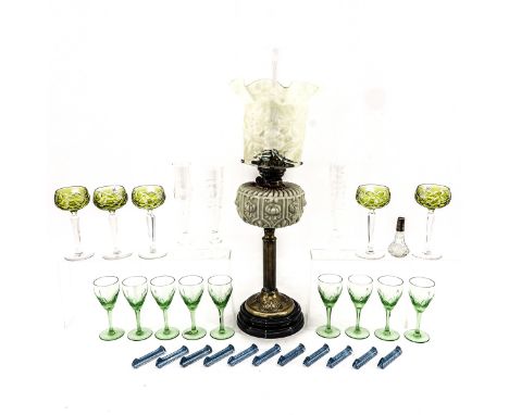 Including drinking glasses and oil lamp with glass head and earthenware base, height 65 cm.