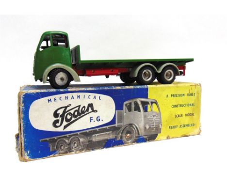 A SHACKLETON FODEN F.G. FLATBED LORRY green with a red chassis and pale grey wheel arches, fitted with a clockwork mechanism,