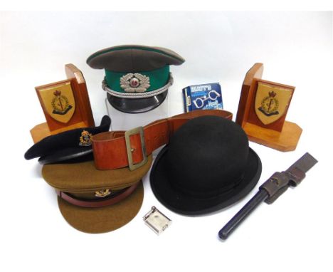 A ROYAL ARMY MEDICAL CORPS PEAKED CAP together with a Royal Army Medical Corps beret, size 7 3/8; a pair of light oak bookend