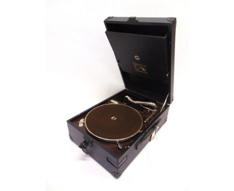 AN H.M.V. PORTABLE GRAMOPHONE with an H.M.V. No.4 reproducer, and ivorine retailer's plaque for 'J.E. Minns, Bridgwater', in 