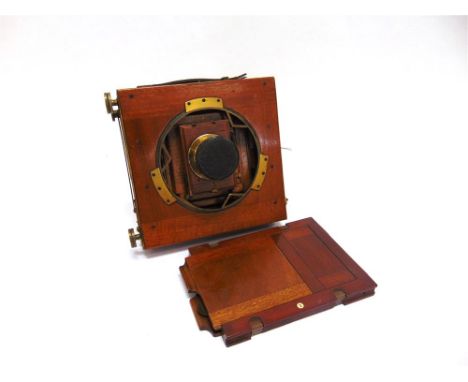 A MIDLAND CAMERA CO. MAHOGANY PLATE CAMERA with lacquered brass fittings and a Beck symmetrical lens, the body with two inset