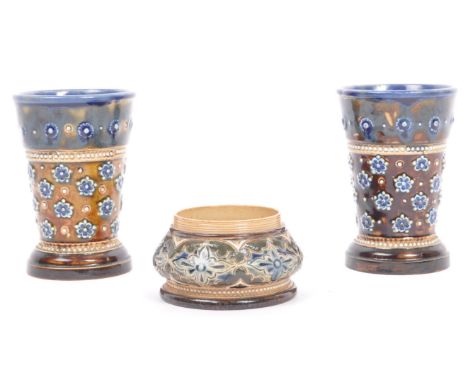 A pair of vintage 20th century Doulton Lambeth stem bud small proportion vases. With floral and bead work on a tapering body 