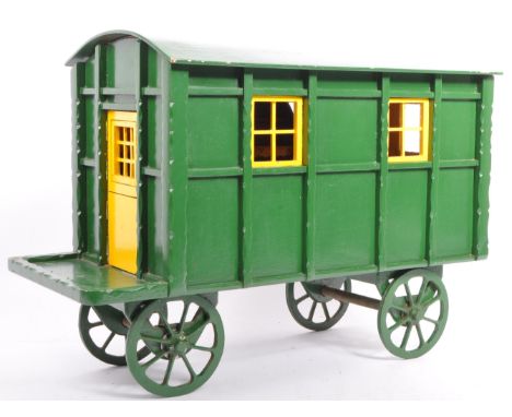 A vintage 20th century painted folk art gypsy traveller hut carriage wagon cart. With removeable arched roof with fitted inte