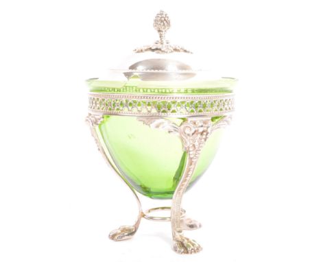 A 19th century Victorian era silver plated lidded jam pot. The pot having berry finial to lid over emerald glass beehive dish