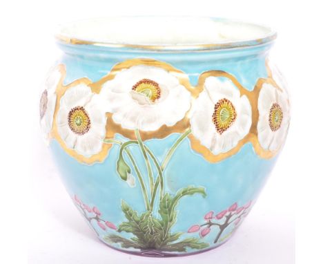 An early 20th century Czech Eichwald Pottery jardinière. The planter having turquoise with raised floral decoration and gilt 