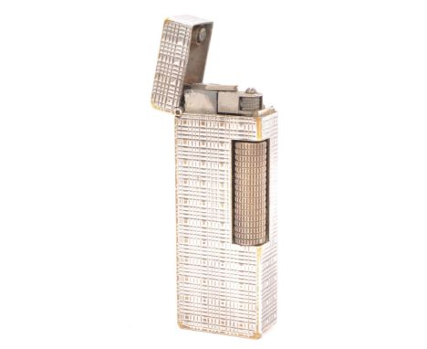 A 20th century silver plated Dunhill cigarette lighter. The lighter having engine turned decoration to the body and being mar