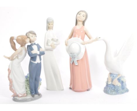 A collection of three Spanish porcelain ceramic Lladro figurines including Nao and one other in the manner of Lladro. Depicti