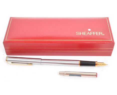 Sheaffer - A 20th century Sheaffer fountain pen in chrome colourway. Held within box with manual and cartridge. Measures 135m