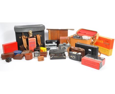 An assortment of mid-century vintage 20th century camera / photographic equipment. The lot to include: An autographic folding