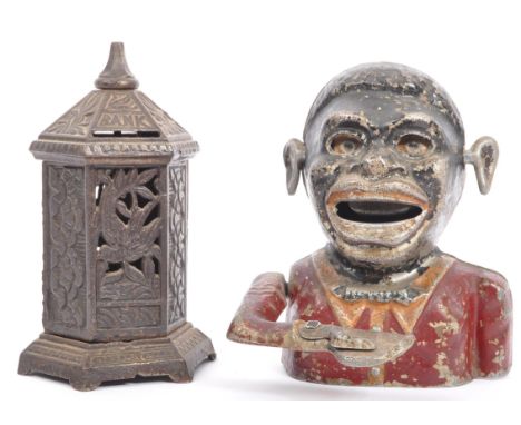 A vintage circa 1940's novelty cast iron money box modelled as the bust of a man with a red shirt and bowtie holding out a ha