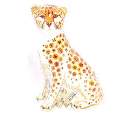 A vintage 20th century Royal Crown Derby fine English bone china animal paperweight, in the form of a leopard, having gilt an