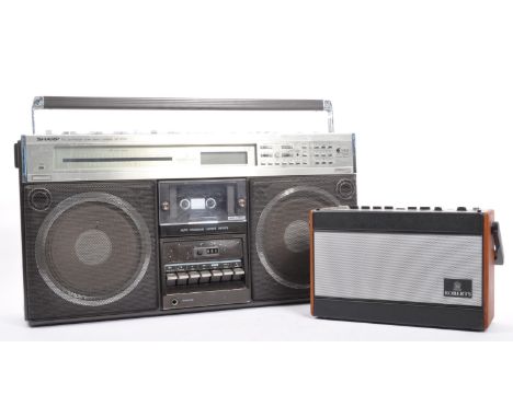 A retro vintage mid 20th century Sharp PLL synthesizer tuner stereo cassette ghetto boom blaster box. Model number GF - 9595.