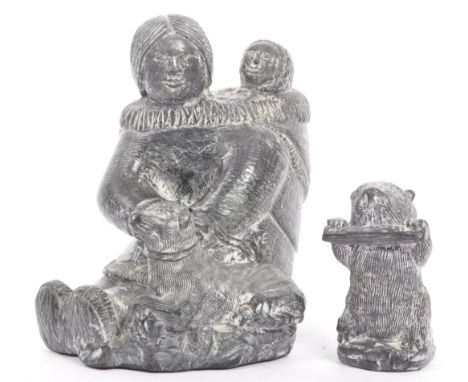 Two vintage mid 20th century Inuit Eskimo carved soapstone figurines of a beaver and a mother, child and dog. Signed by artis