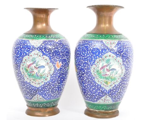 A pair of early 20th century copper &amp; enamel hand painted decorative vases. Each having a copper flared rim neck over a i