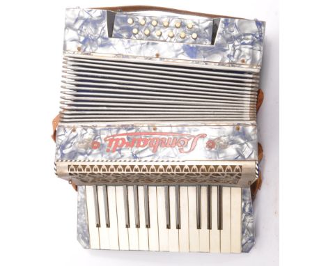 A vintage, mid 20th century&nbsp;Lombardi accordion in original black leather case, with fully functional bellows. Measures a