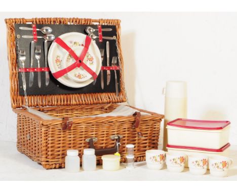 A vintage 20th century Antler canework cased picnic hamper basket set. To include, a Viners stainless steel canteen of cutler