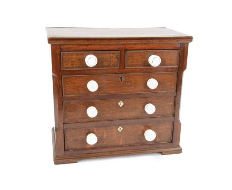 Wooden table top chest, two short over three long drawers, with ceramic handles, H42cm, L46cm 