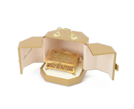 By Theo Faberge, a modern silver-gilt Mozart Box, the hinged lid decorated with Papageno and Papagena playing the magic bells