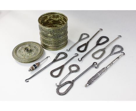 A collection of ten button hooks marked Mundys, Levy, J Sears & Co, some with advertising on the handle, together with a smal