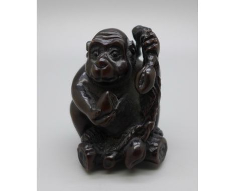 An ironwood monkey netsuke 