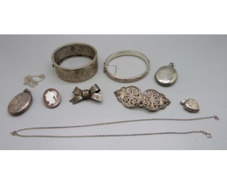 A Victorian bangle, a silver bangle, silver jewellery and a silver buckle 